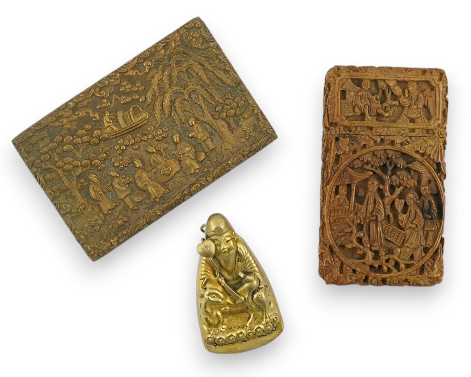 A Chinese carved sandalwood card case, a bronze relief cast and chased plaque and a gilt metal Shou Lao pendant, card case 7.5cm high. Condition - good